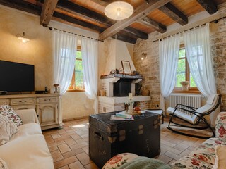 Inviting lounge area with fireplace and TV