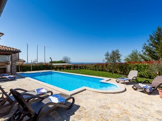 Private pool with sun loungers in villa in Istria
