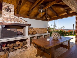 Charcoal grill and dining table in villa in Porec