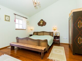 Rustic bedroom with double bed in Porec