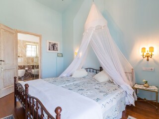 Bedroom with double bed and ensuite bathroom