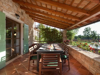 Covered outdoor dining area in Villa Valade