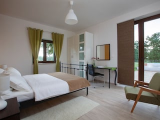 Bedroom with double bed in Villa Valade