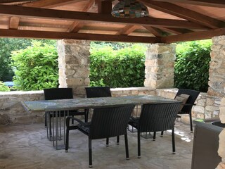 Covered outdoor seating area in Casa Rupeni