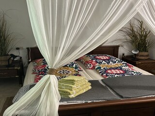 Schlafzimmer mit Doppelbett in Casa Rupeni