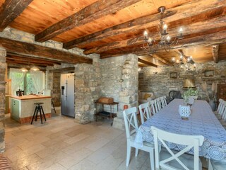 Dining area with kitchen in villa in Central Istria