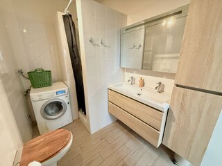 bathroom with washing mach