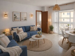 das gemütliche Wohnzimmer mit Balkon und Meerblick