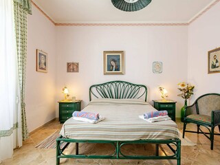 Cozy double bed in green style