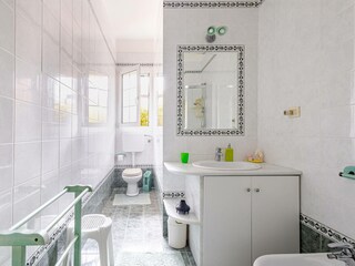 Bright bathroom with shower and mirror