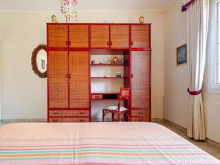 Large rattan wardrobe with desk area