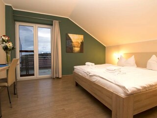 Schlafzimmer mit Dachterrasse