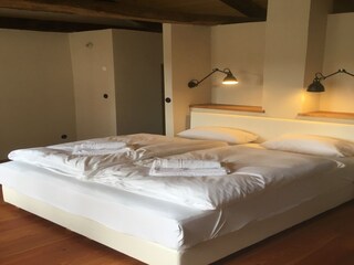 Comfortable bedroom with double bed in villa
