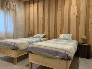 master room with 2 single beds