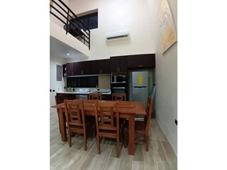Kitchen with dining set made of Guanacaste wood