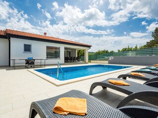 Modern villa with private pool and sun loungers, Labin