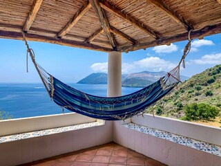 Hammock swinging above the sea