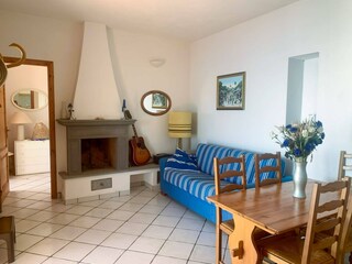 Living room with fireplace and guitar