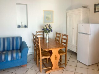 Dining with coat stand and fireplace