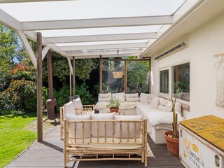 The covered terrace in the backyard