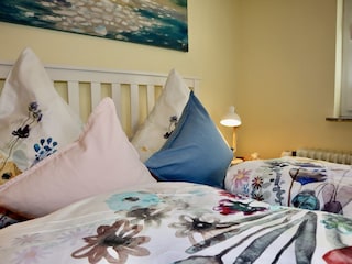 Sleeping area with double bed and lovely details