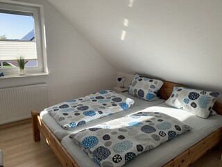 Das zweite Schlafzimmer im 1. Stock.