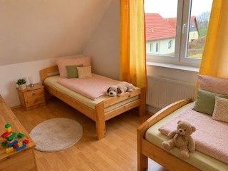 Das zweite Schlafzimmer im OG.
