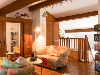 Gallery with a seating area and a wardrobe