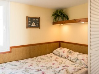 Bedroom with a double bed and a wardrobe