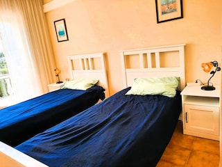 Twin bedroom with aircon and balcony