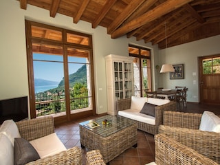 Living room with kitchen, overlooking Lake Garda.