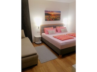 Schlafzimmer mit zusätzlichem Schlafsofa