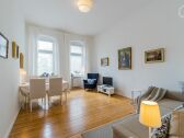 big and sunny Living-room with big table und Couch