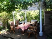 Pavilion with charcoal grill, firewood and garden