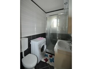Bathroom with a washingmachine