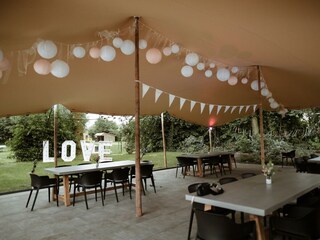 Festive dinner setting in the park's group tent