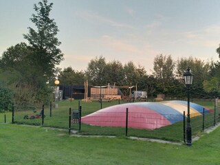 Air trampoline and playground on the park