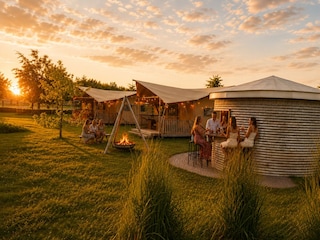 Glamping with friends at sunset