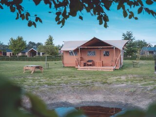 Glamping tent on the meadow