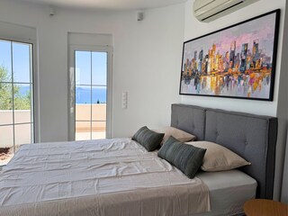 Villa Mandola - Schlafzimmer mit Garten und Meerblick