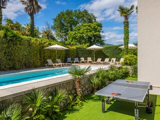 Table tennis next to the private pool
