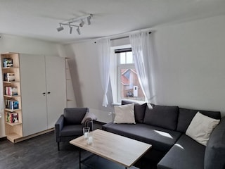 Wohnzimmer mit Schlafsofa