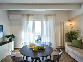 Villa Esther - Dining Table with kitchen and a sofa