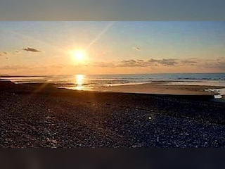 The pebble beach at sunset, 200 m away