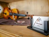 Violin on the kitchen buffet with business card.