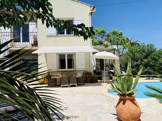 The villa with one of the terraces by the swimming pool