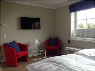 Schlafzimmer mit Sitzecke