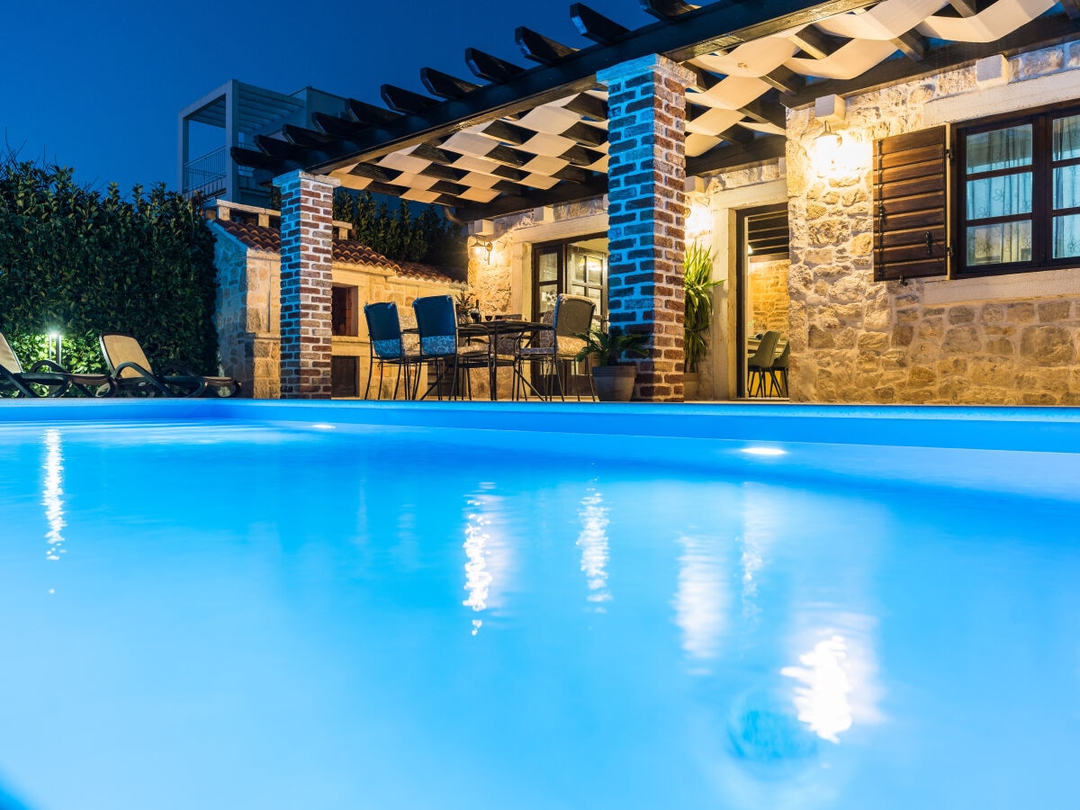 Swimming pool & house in night