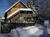 Ferienwohnung und Garten im Winter