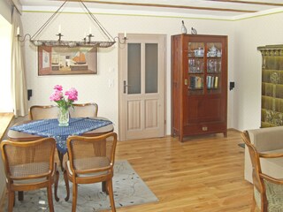 Living room with large windows and period furniture